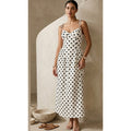 Robe blanche à pois noir