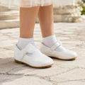 Ballerine blanche de cérémonie pour fille avec bride élastiquée et double nœud